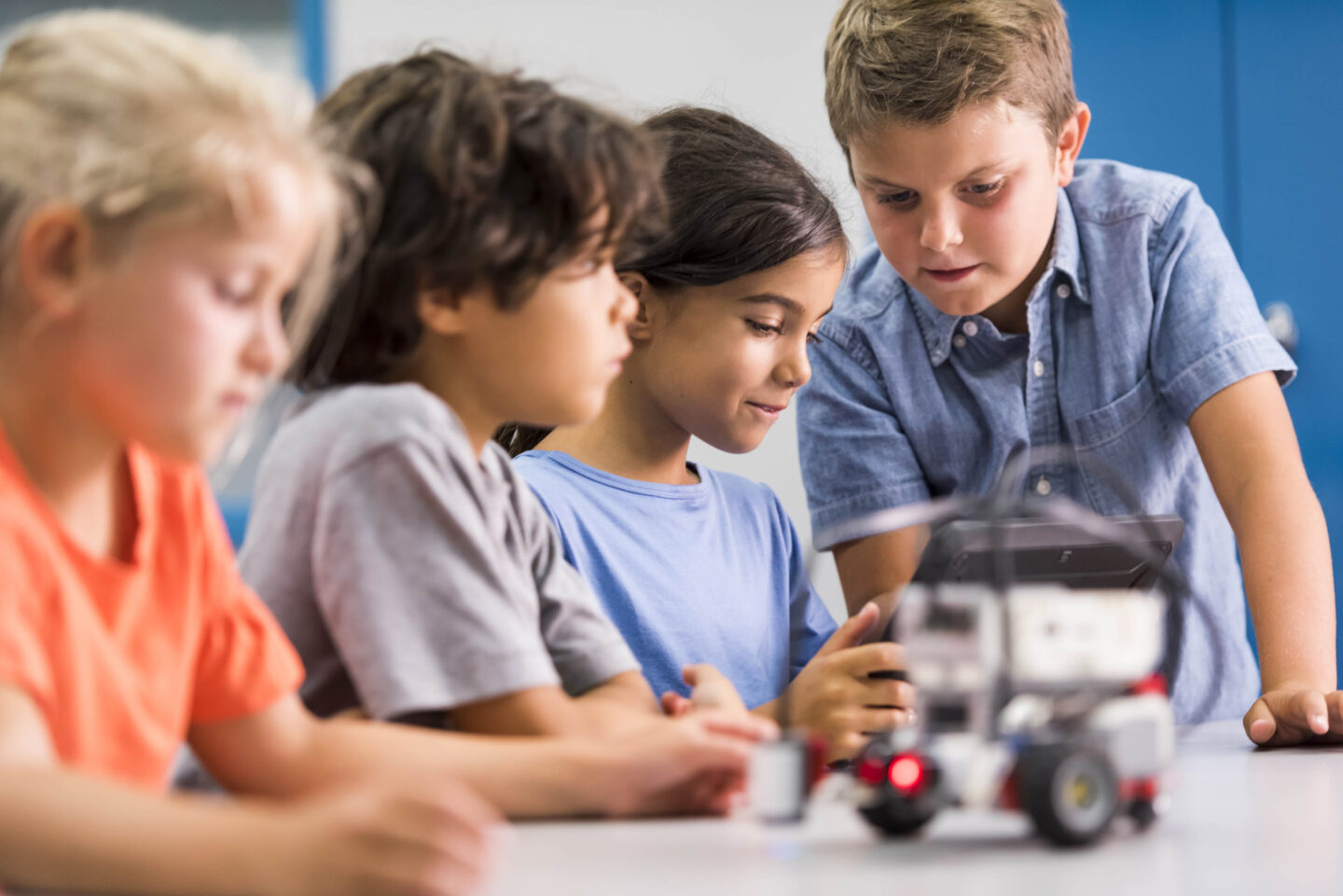 Four students work together to build a robot car