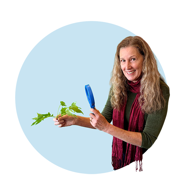 Community Science Hero Teresa Barnett, Holding a Magnifying Glass