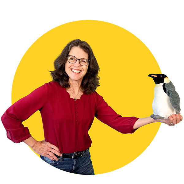 Community Science Hero Jenny Hartigan, holding a stuffed penguin toy